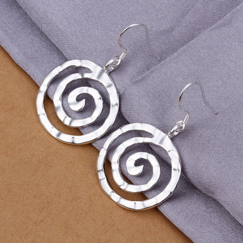 Modern women’s round earrings, perfect for statement style.