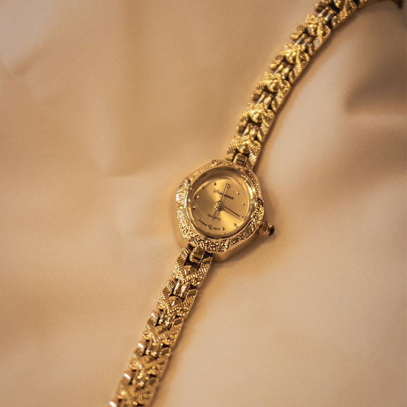 Classic watch with gold and silver details.