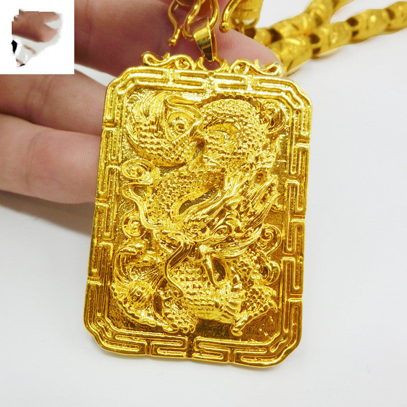 Solid 40g dragon pendant with intricate detailing.